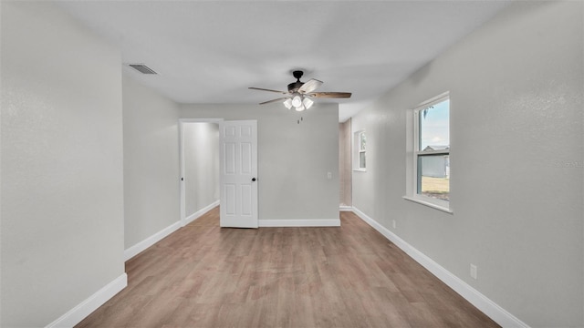 1650 W Mcleod St, Bartow, FL 33830 - empty room with wood finished floors, ceiling fan, and baseboards