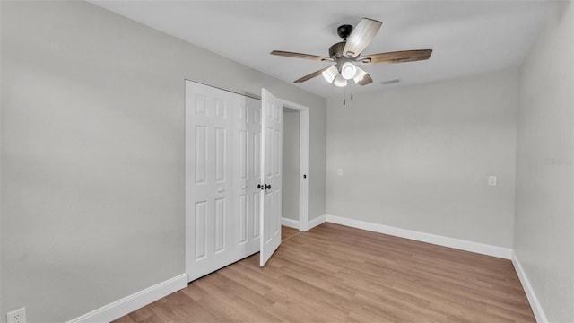 1650 W Mcleod St, Bartow, FL 33830 - unfurnished bedroom with baseboards, light wood-style flooring, a closet, and a ceiling fan