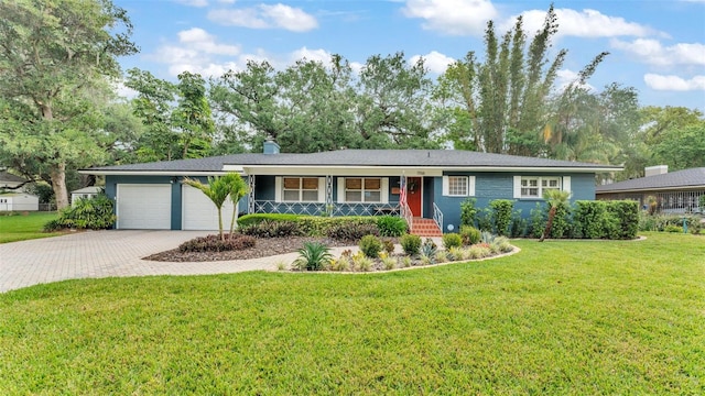 ranch-style home with a front lawn, driveway, and an attached garage