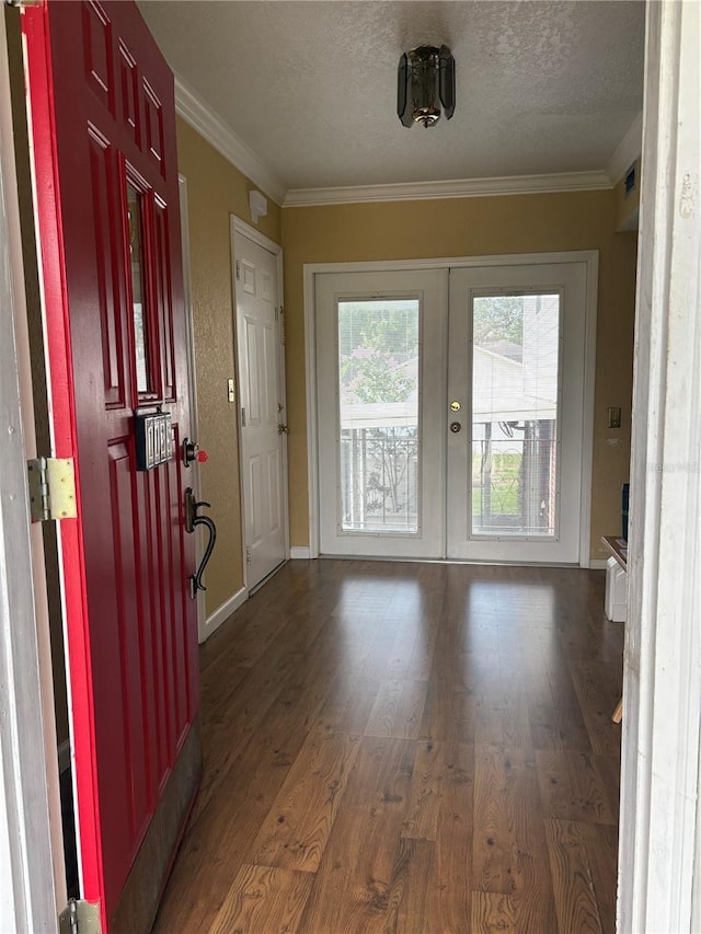 1135 Palace Pl, Lakeland, FL 33813 - entryway with french doors, dark wood-style floors, ornamental molding, and a textured ceiling