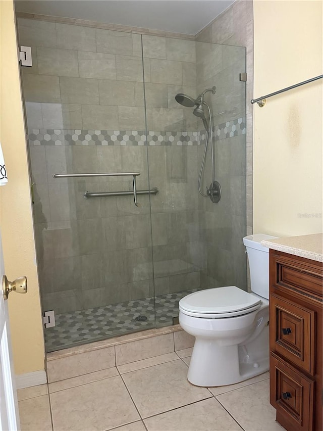1135 Palace Pl, Lakeland, FL 33813 - bathroom featuring a shower stall, vanity, and tile patterned floors