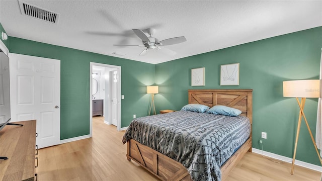 3273 Sennett Cir, Oxford, FL 34484 - bedroom featuring baseboards, visible vents, and light wood-style floors