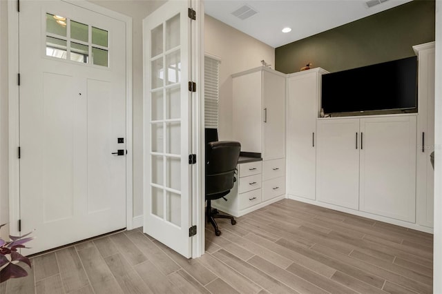 interior space with recessed lighting, light wood-style floors, and visible vents