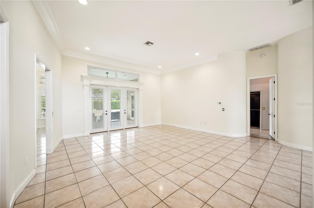 empty room with crown molding, french doors, light tile patterned flooring, recessed lighting, and baseboards