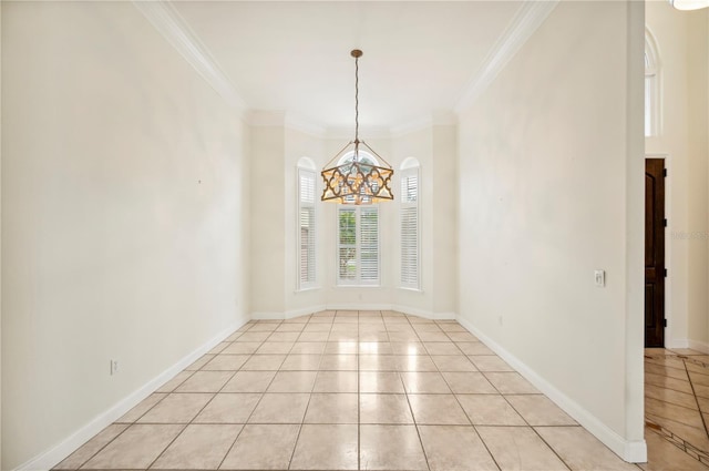 unfurnished dining area featuring a chandelier, light tile patterned flooring, ornamental molding, and baseboards