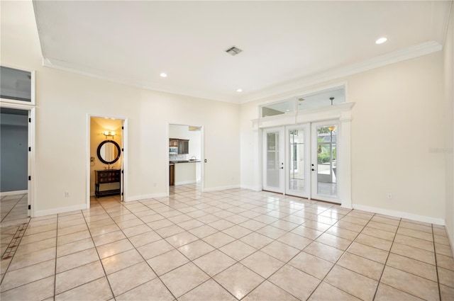 unfurnished living room with crown molding, light tile patterned floors, baseboards, french doors, and recessed lighting