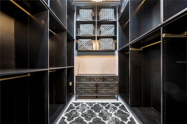 walk in closet with tile patterned flooring