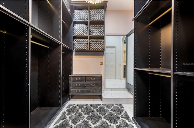 walk in closet with tile patterned flooring