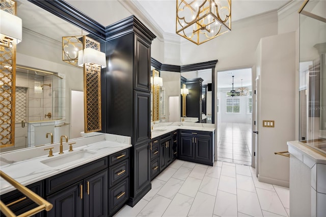 full bath with crown molding, a shower stall, a chandelier, two vanities, and marble look tile flooring