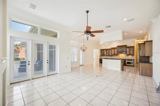 unfurnished living room featuring a ceiling fan, recessed lighting, light tile patterned floors, and french doors
