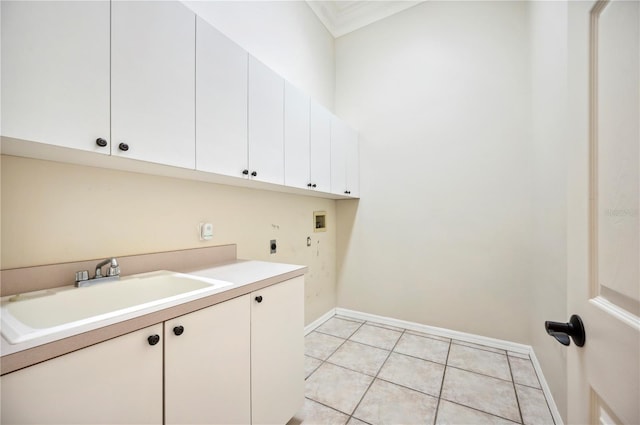 laundry area with hookup for an electric dryer, cabinet space, hookup for a washing machine, baseboards, and light tile patterned flooring