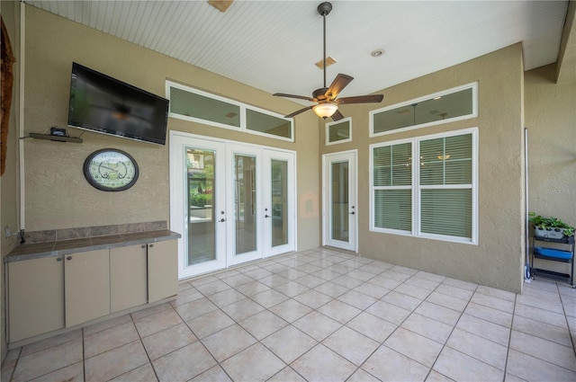 unfurnished sunroom with french doors