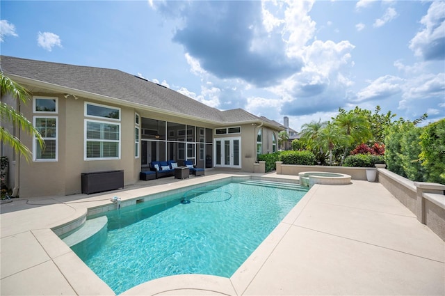 view of swimming pool featuring french doors, an outdoor hangout area, a patio area, and a pool with connected hot tub