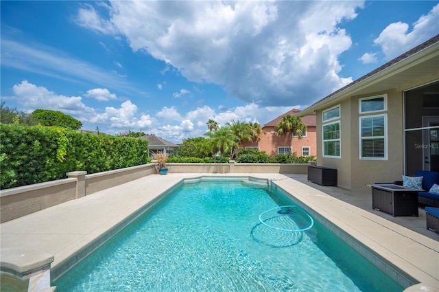 view of pool featuring a patio