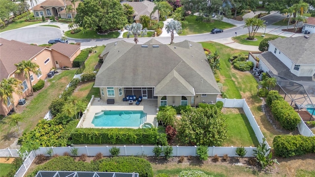 aerial view of residential area featuring a pool