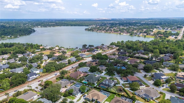 view of property location featuring a nearby body of water and nearby suburban area