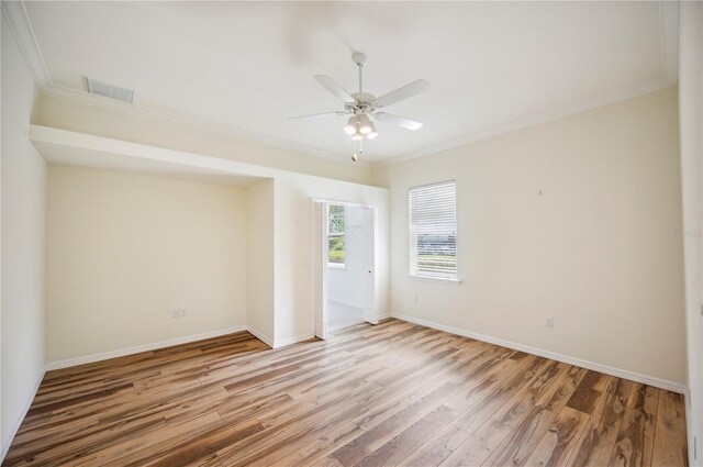 715 Hanover Ct, Lakeland, FL 33813 - unfurnished room with ceiling fan, light wood-type flooring, ornamental molding, and baseboards