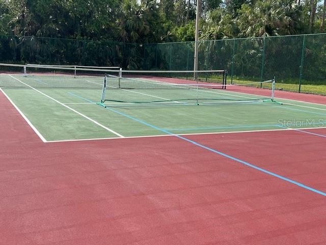 view of sport court with community basketball court and fence