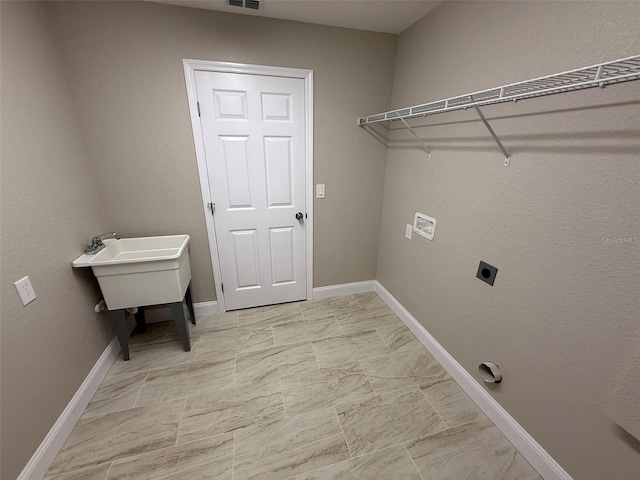 laundry room featuring hookup for an electric dryer, visible vents, laundry area, and baseboards