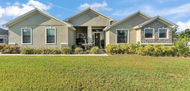 6372 English Creek Dr, Lakeland, FL 33811 - view of front of house featuring stucco siding and a front lawn