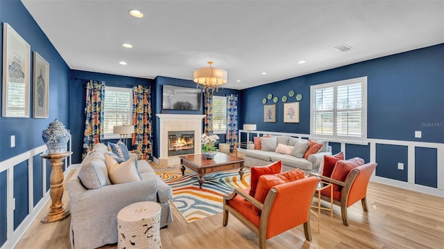 6372 English Creek Dr, Lakeland, FL 33811 - living room featuring plenty of natural light, light wood-style floors, recessed lighting, and wainscoting