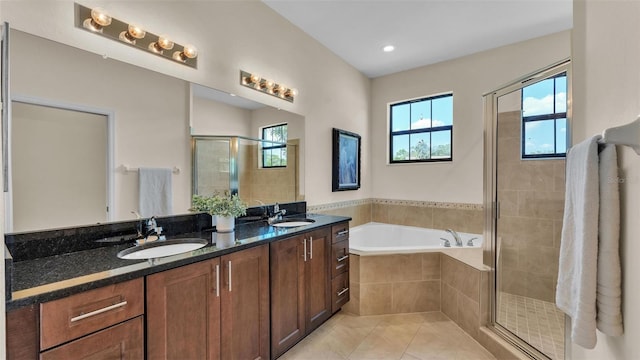 6372 English Creek Dr, Lakeland, FL 33811 - full bath featuring a stall shower, a garden tub, double vanity, and tile patterned floors