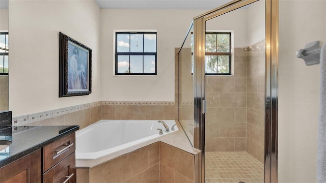 6372 English Creek Dr, Lakeland, FL 33811 - bathroom featuring vanity, a garden tub, and a stall shower