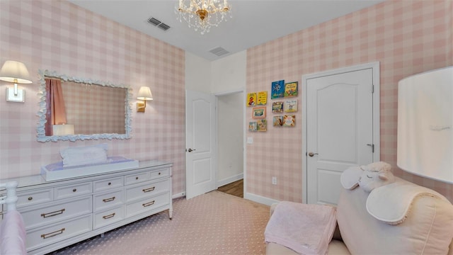 6372 English Creek Dr, Lakeland, FL 33811 - bedroom with wallpapered walls, a chandelier, and carpet floors