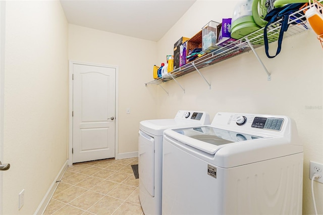6372 English Creek Dr, Lakeland, FL 33811 - laundry area with washing machine and dryer and light tile patterned floors