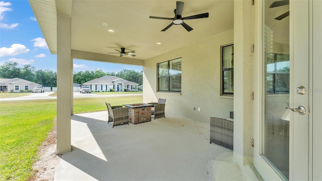 6372 English Creek Dr, Lakeland, FL 33811 - view of patio / terrace with ceiling fan and an outdoor fire pit