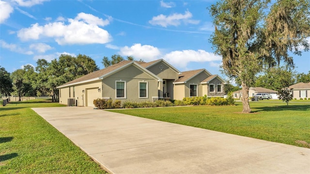 6372 English Creek Dr, Lakeland, FL 33811 - ranch-style home with concrete driveway, an attached garage, stucco siding, and a front lawn