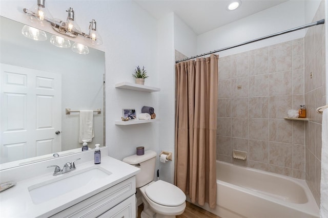 full bathroom featuring toilet, shower / tub combo, wood finished floors, and vanity