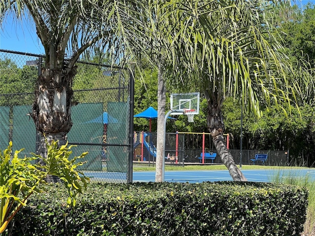 view of basketball court with fence and community basketball court