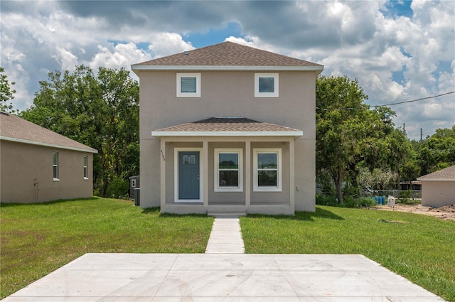 4189 Radford Rd, Bartow, FL 33830 - rear view of property with stucco siding, a yard, and a shingled roof