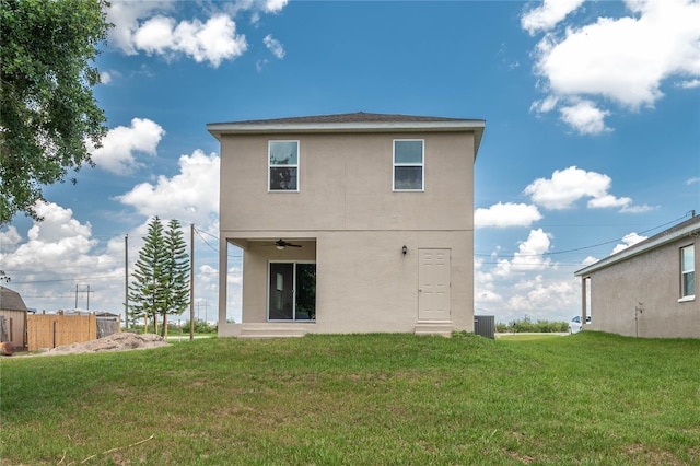 4189 Radford Rd, Bartow, FL 33830 - back of property featuring stucco siding, a lawn, ceiling fan, and central AC