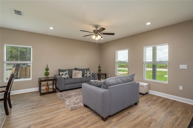 4189 Radford Rd, Bartow, FL 33830 - living area featuring light wood finished floors, baseboards, ceiling fan, and recessed lighting