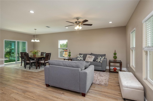 4189 Radford Rd, Bartow, FL 33830 - living room featuring light wood-type flooring, a chandelier, a ceiling fan, recessed lighting, and baseboards