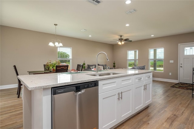 4189 Radford Rd, Bartow, FL 33830 - kitchen with stainless steel dishwasher, a sink, a kitchen island with sink, light wood finished floors, and recessed lighting