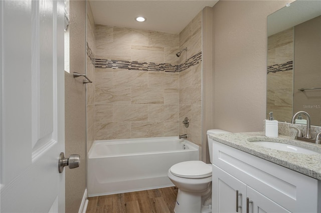 4189 Radford Rd, Bartow, FL 33830 - bathroom with vanity, shower / bath combination, toilet, wood finished floors, and recessed lighting