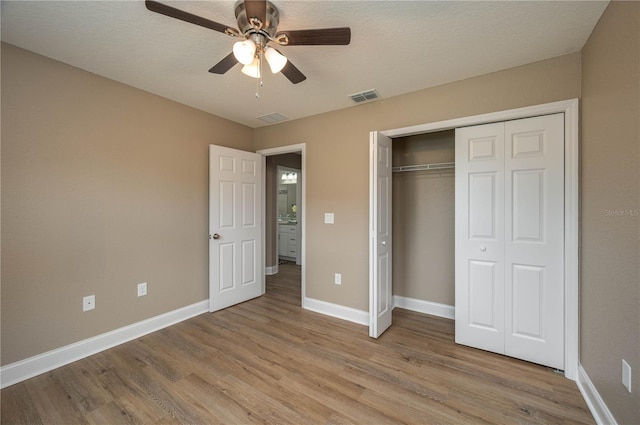 4189 Radford Rd, Bartow, FL 33830 - unfurnished bedroom with light wood-style flooring, baseboards, a closet, and ceiling fan