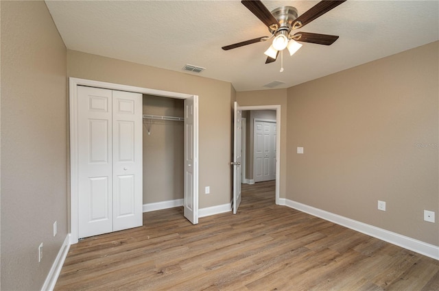 4189 Radford Rd, Bartow, FL 33830 - unfurnished bedroom featuring light wood finished floors, a closet, and baseboards