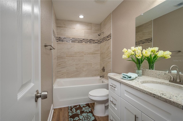 4189 Radford Rd, Bartow, FL 33830 - bathroom featuring vanity, toilet, bathing tub / shower combination, and wood finished floors