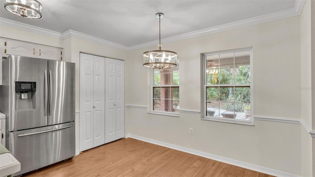 kitchen featuring a chandelier, crown molding, stainless steel fridge with ice dispenser, and light wood finished floors