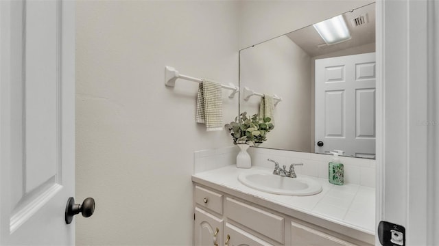 bathroom with visible vents and vanity