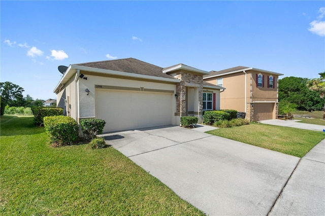 view of front of home featuring a front yard, driveway, stucco siding, and stone siding