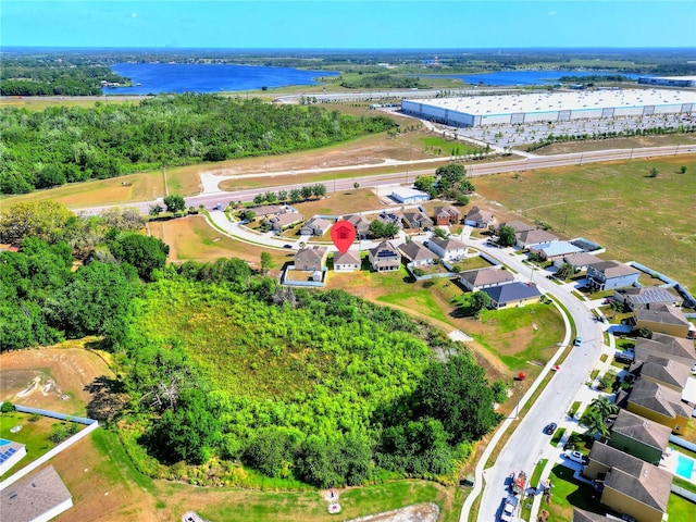bird's eye view with a water view and a residential view