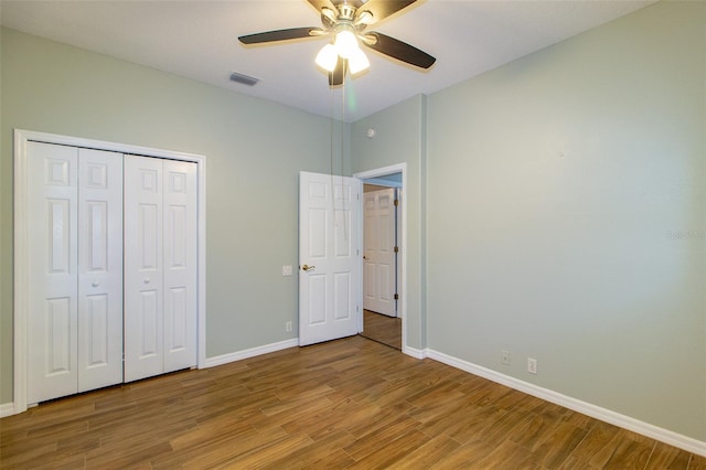 6626 Royal Forest Dr, Lakeland, FL 33811 - unfurnished bedroom featuring baseboards, a closet, a ceiling fan, light wood-style floors, and visible vents