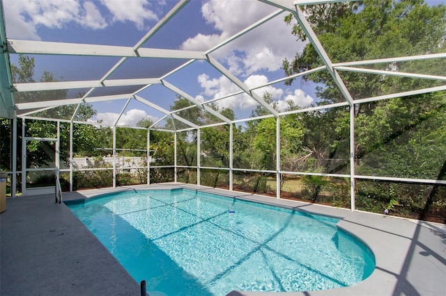 6626 Royal Forest Dr, Lakeland, FL 33811 - outdoor pool with a patio and glass enclosure