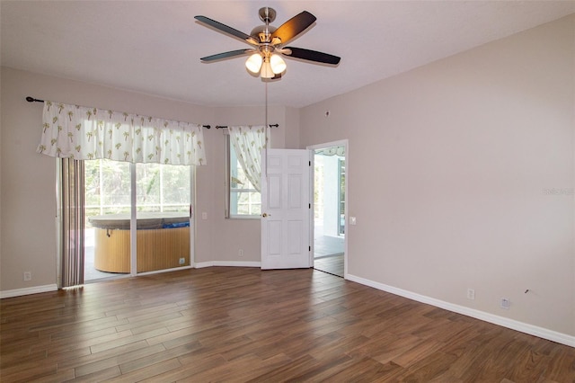 6626 Royal Forest Dr, Lakeland, FL 33811 - empty room with wood finished floors, baseboards, and a ceiling fan