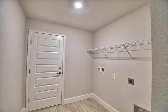 laundry room with light wood finished floors, washer hookup, hookup for an electric dryer, laundry area, and baseboards